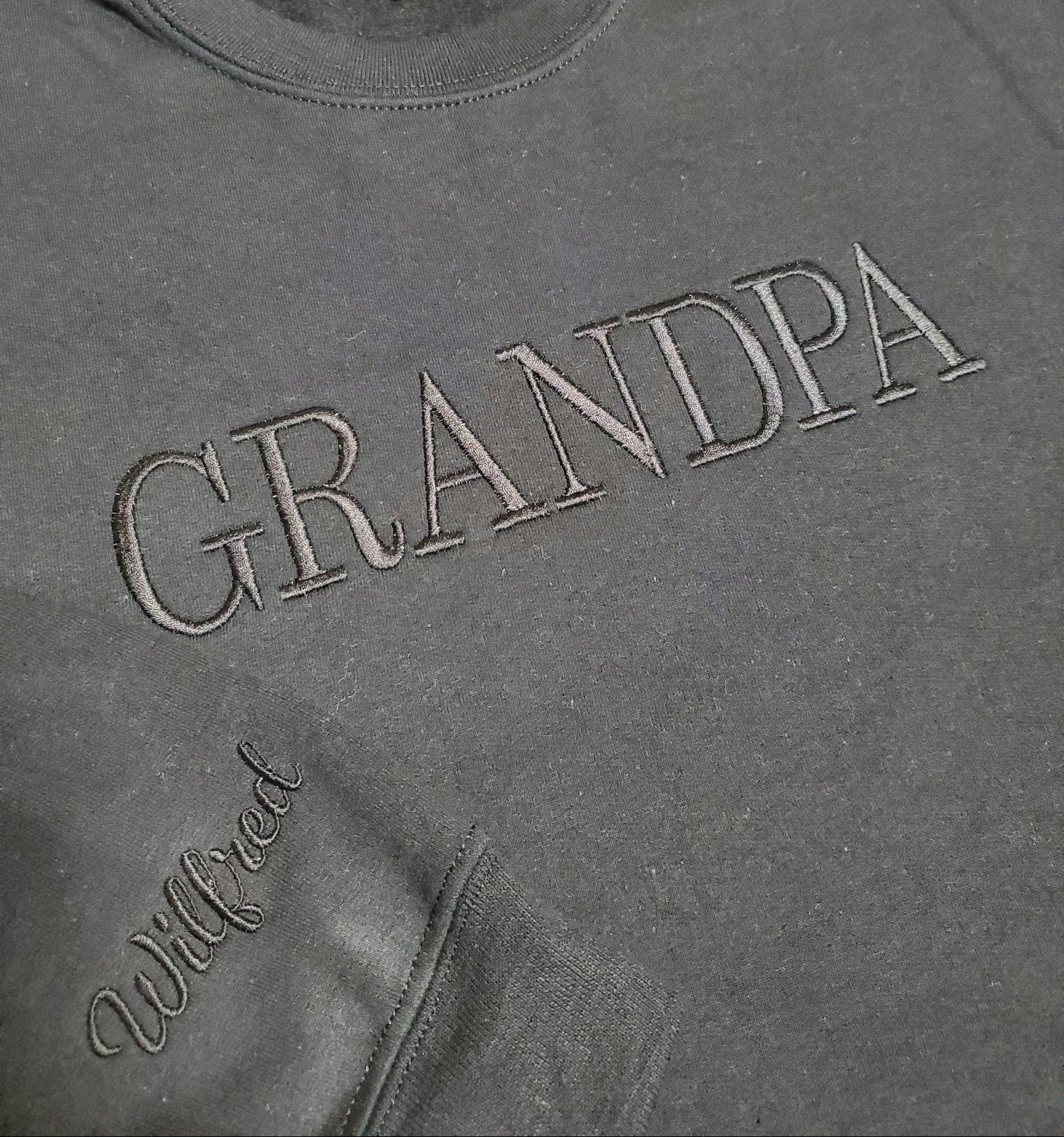 Gray sweatshirt with 'GRANDPA' and 'Wilfred' text on a grid background
